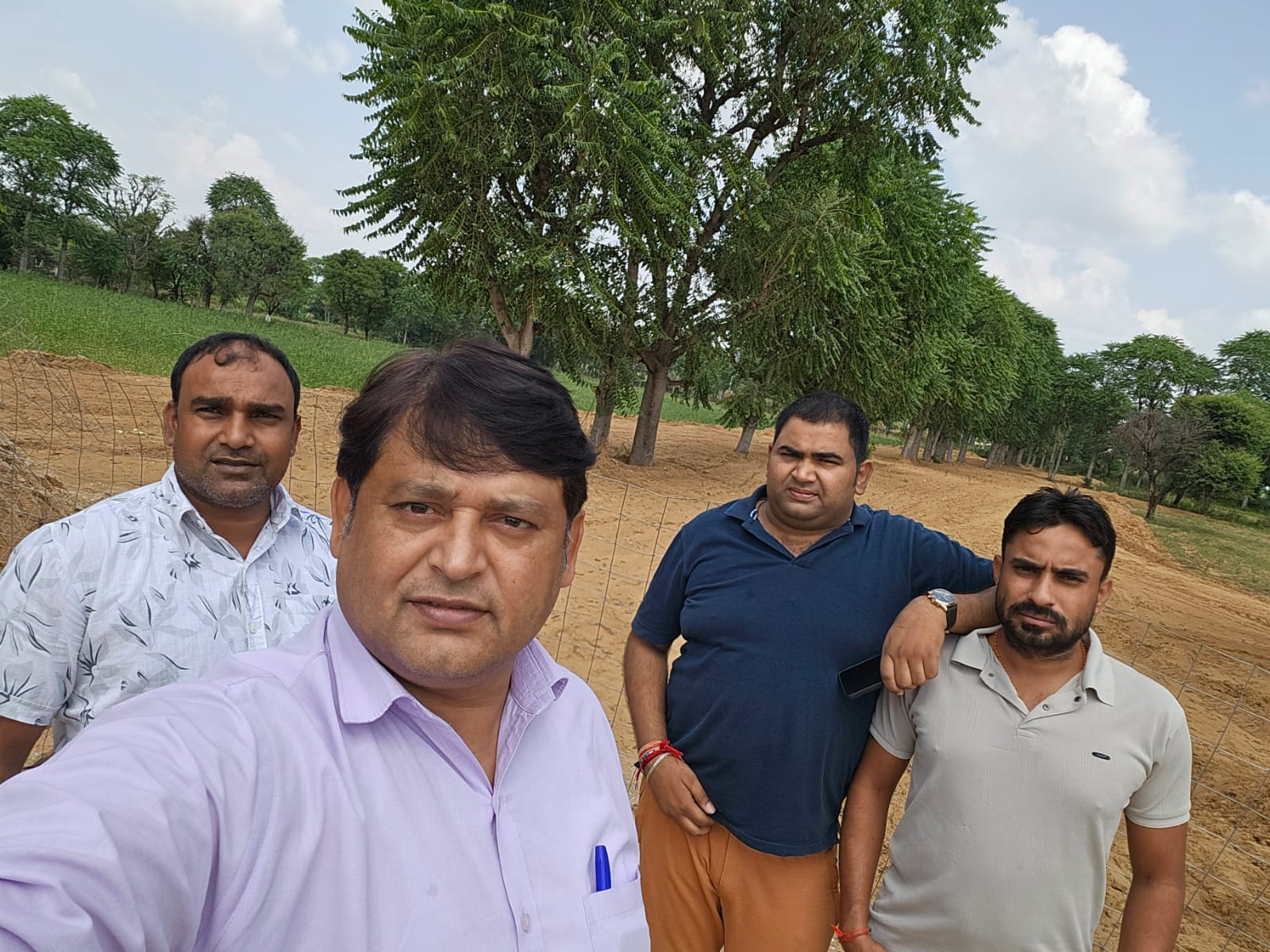 Visitors at a tree-lined site